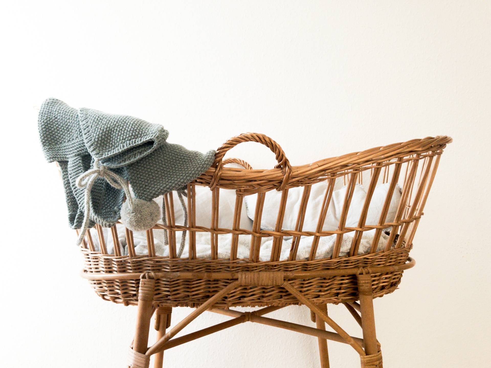grey textile hanging on brown wicker basket