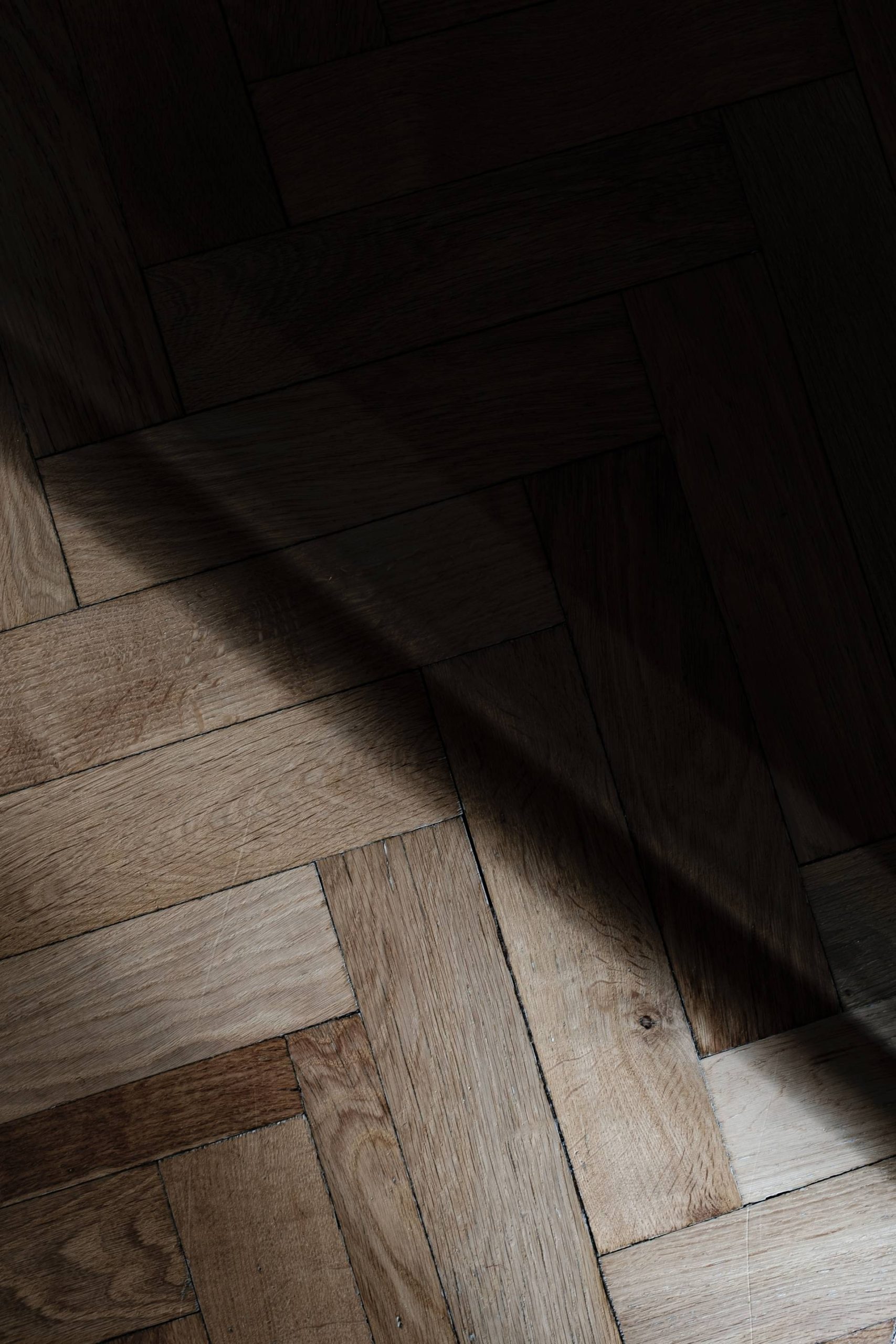 hardwood flooring obscured by a partial shadow