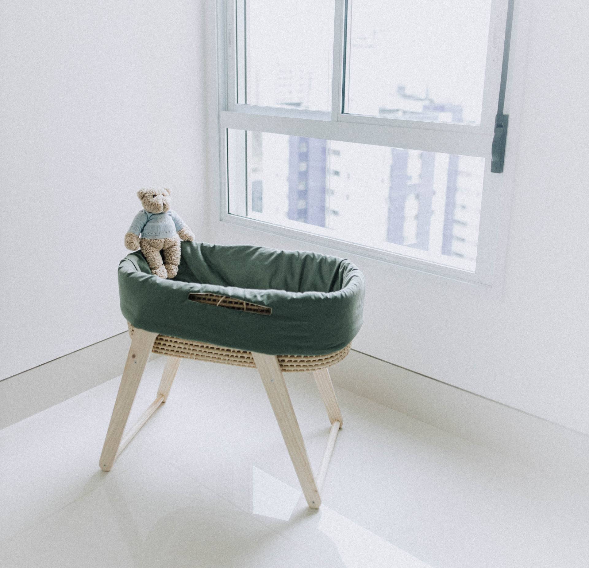 Baby crib in middle of white room