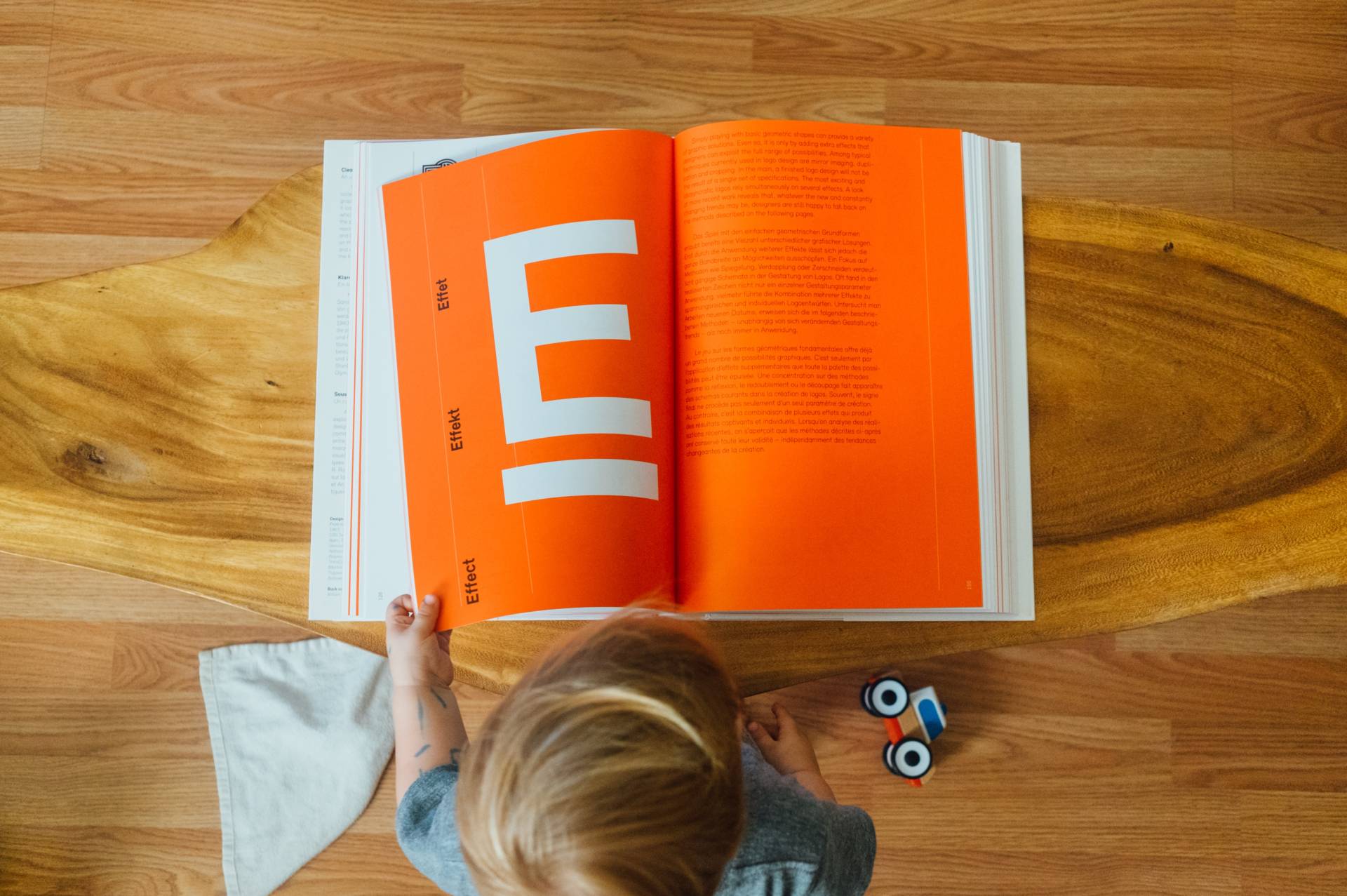 overhead shot of child reading book