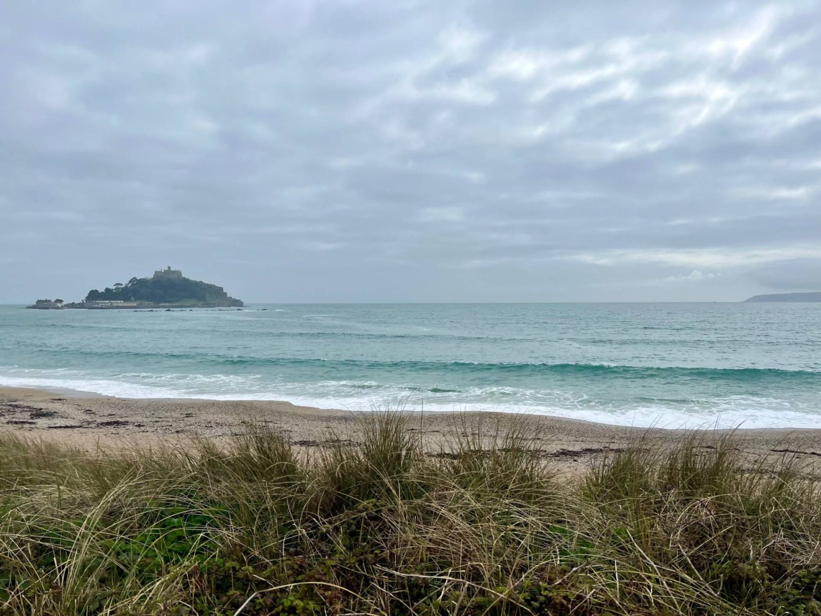 view of St Michael's Mount from the mainland with beach